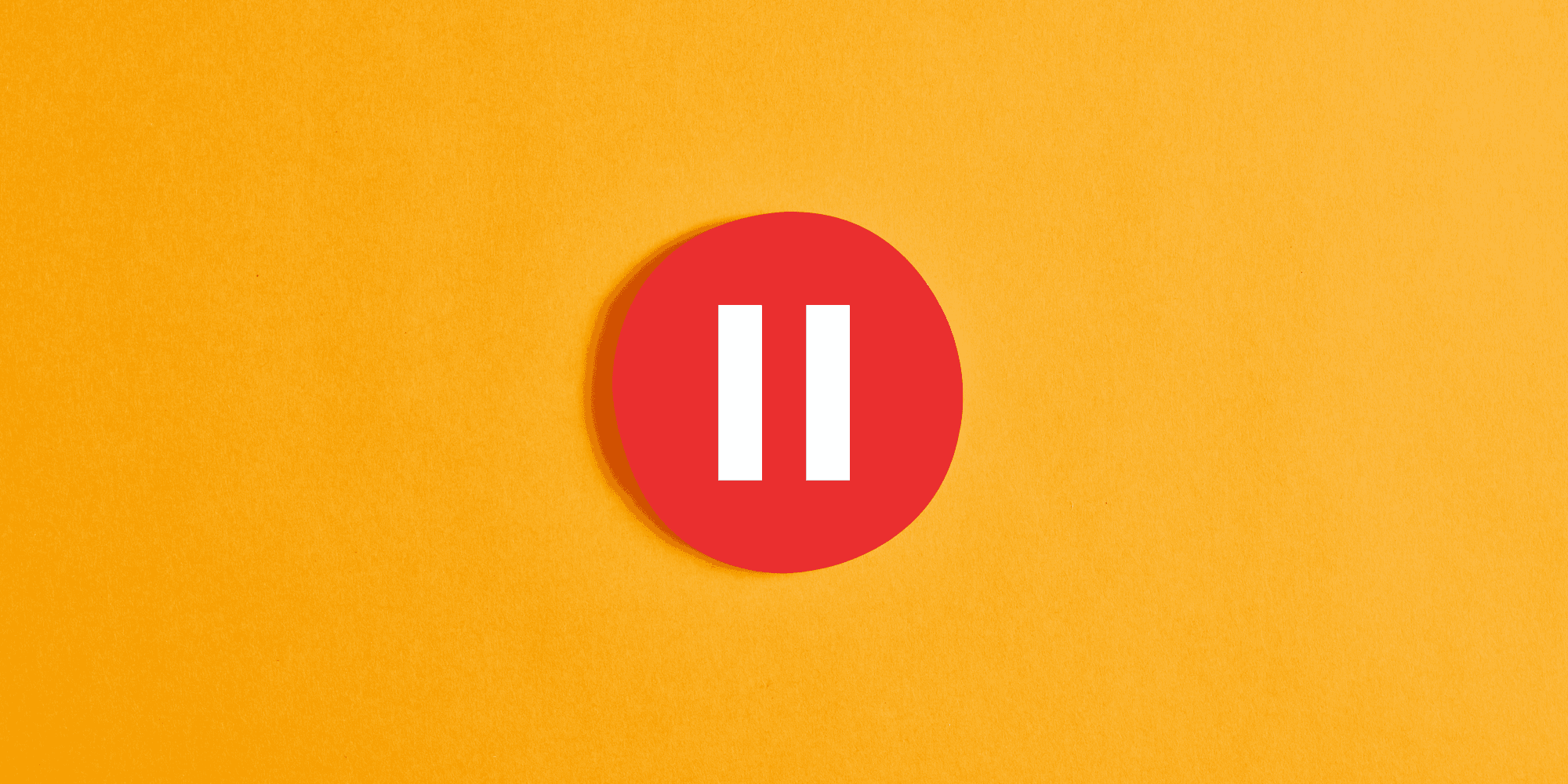 red and white circular pause button against an orange-yellow background